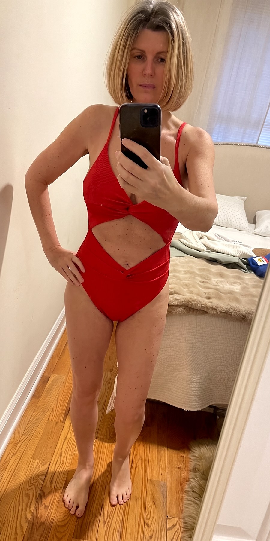After, a mirror photo in a red swimsuit
