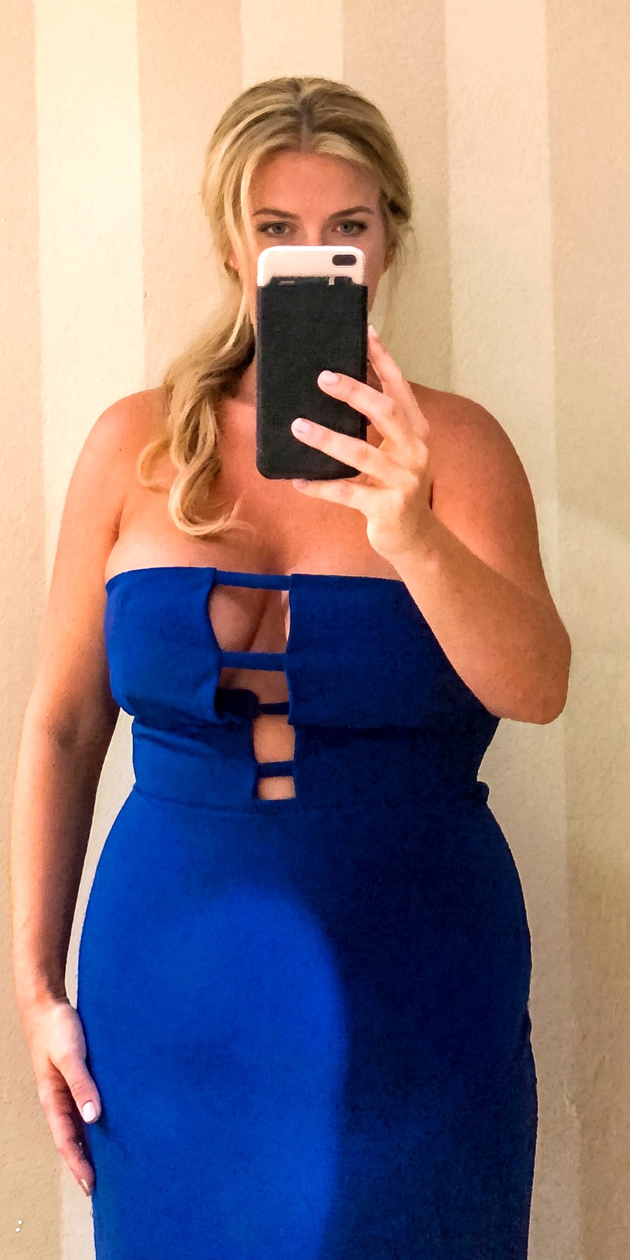 Before, a mirror photo in a blue dress