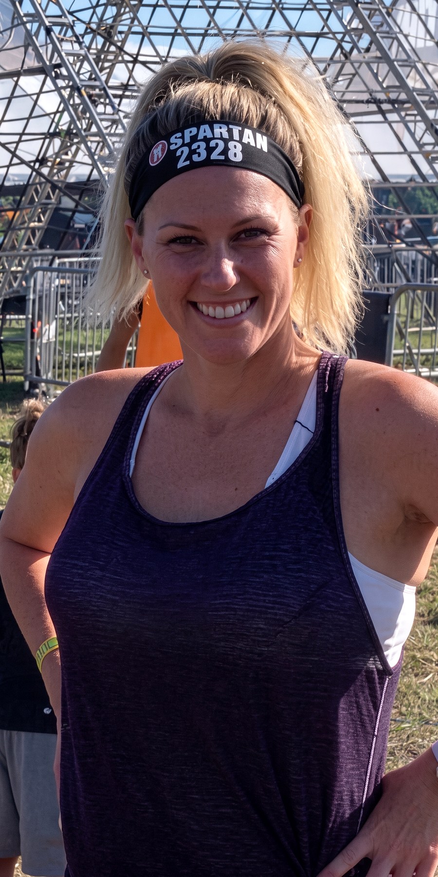 Before, at an obstacle race in a purple tank and headband